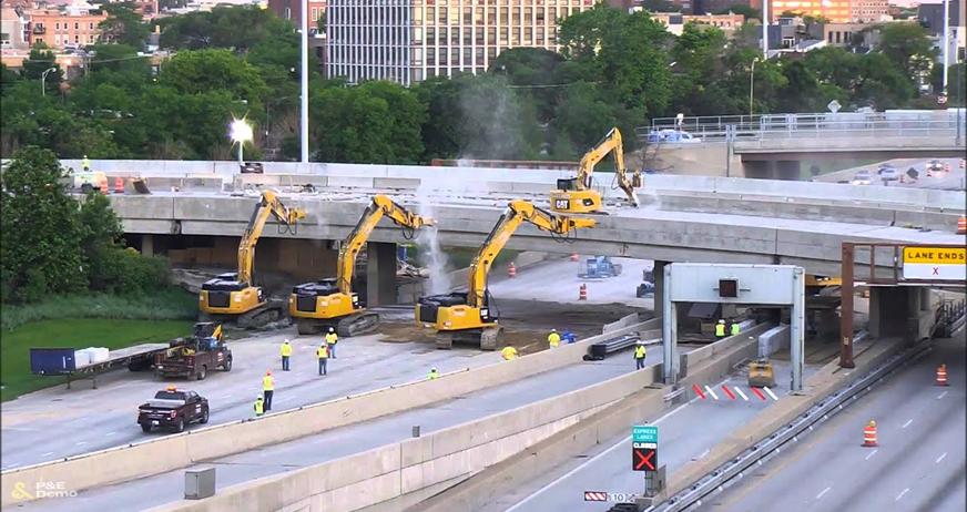 Multiple excavators dismantling elevated concrete roadway during professional walkway and bridge demolition services in New Jersey